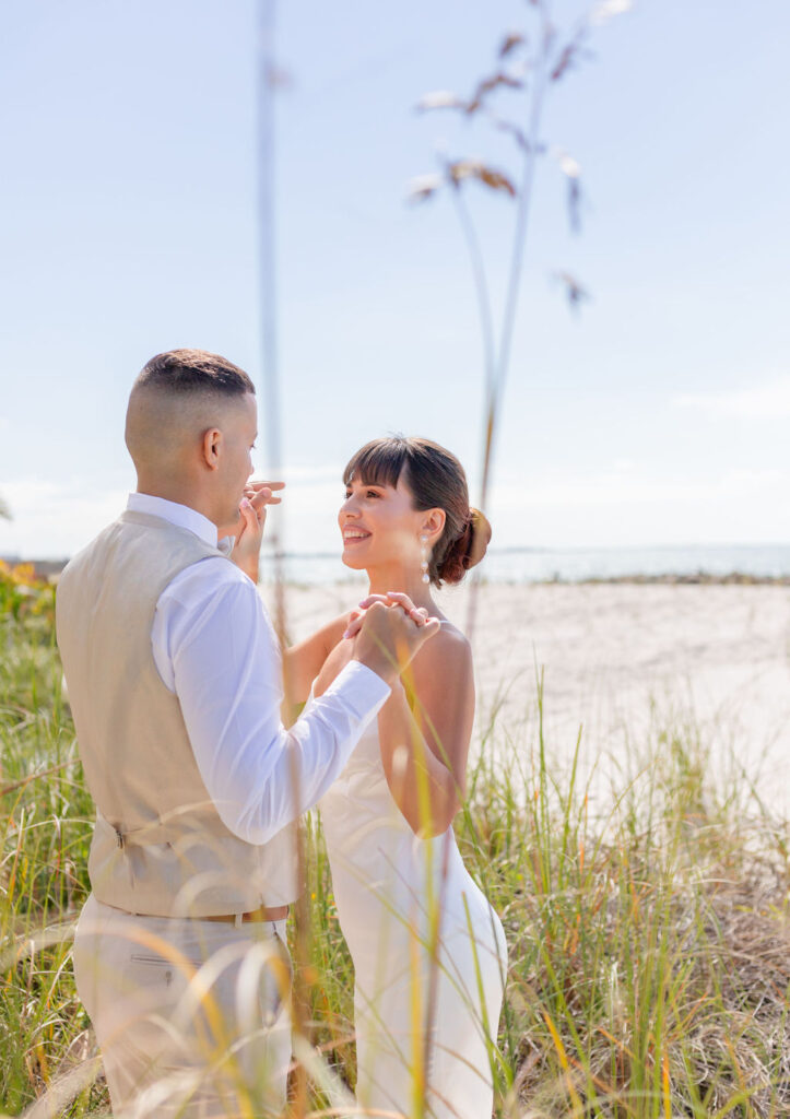 Beach wedding couple dancing