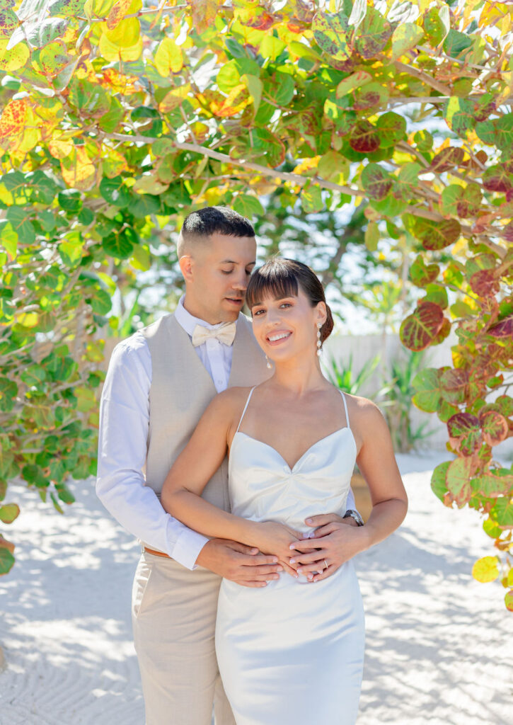 Beach wedding couple prom pose