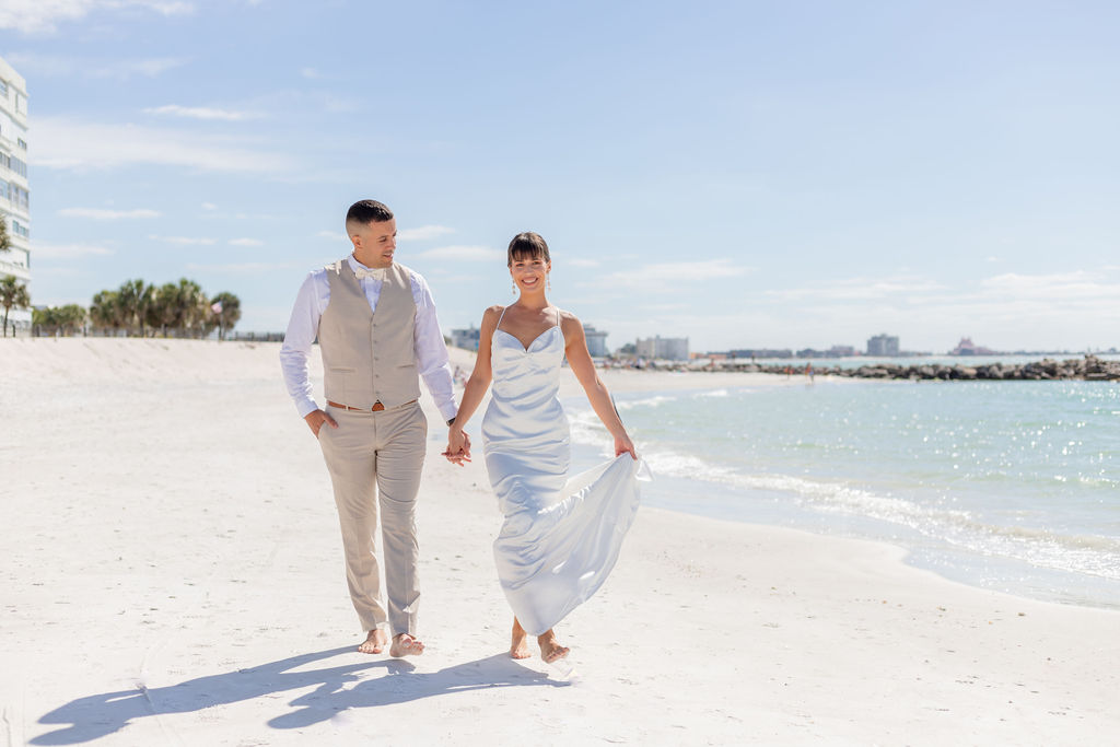 Beach wedding couple walking