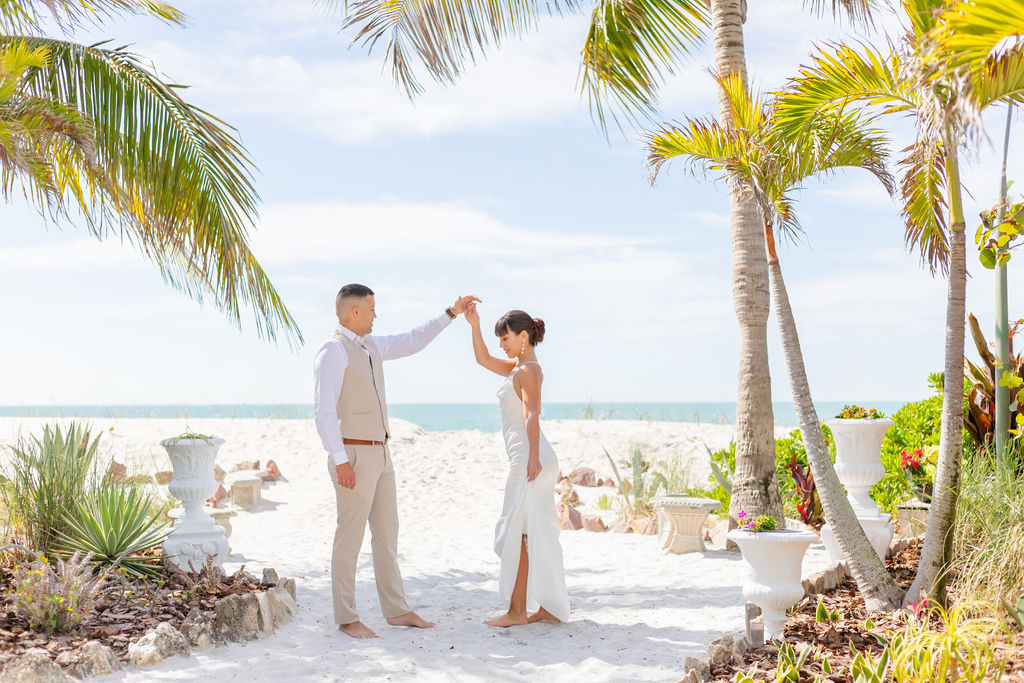 Beach wedding couple dancing