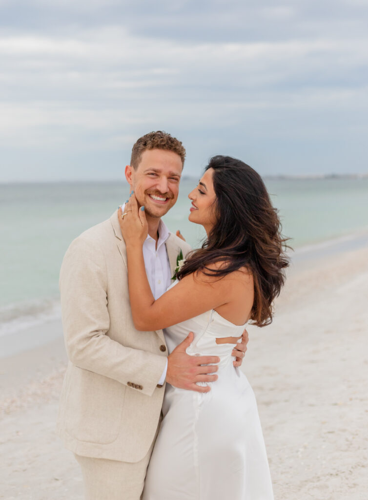 Wedding couple portraits classic smiling at a beach 