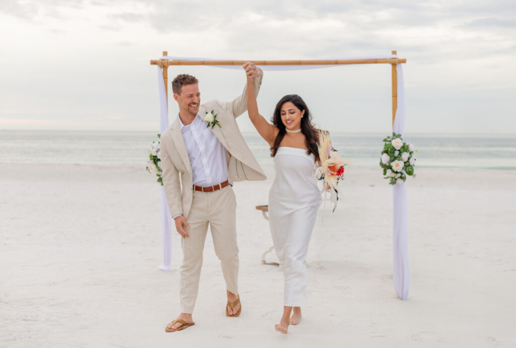 Wedding couple enjoying a romantic moment during sunset at Saint Pete Beach.