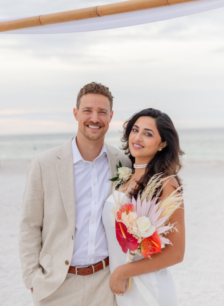 Wedding couple portraits classic smiling at a beach 