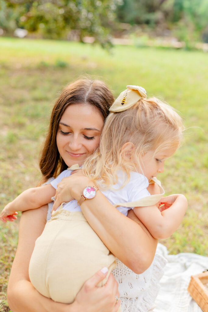 Mama hugging her little girl at Philippe's park