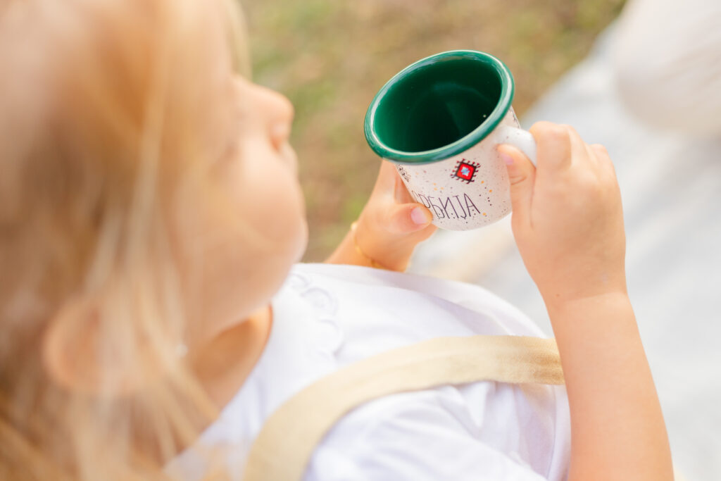 Little girl holding a cup Serbia