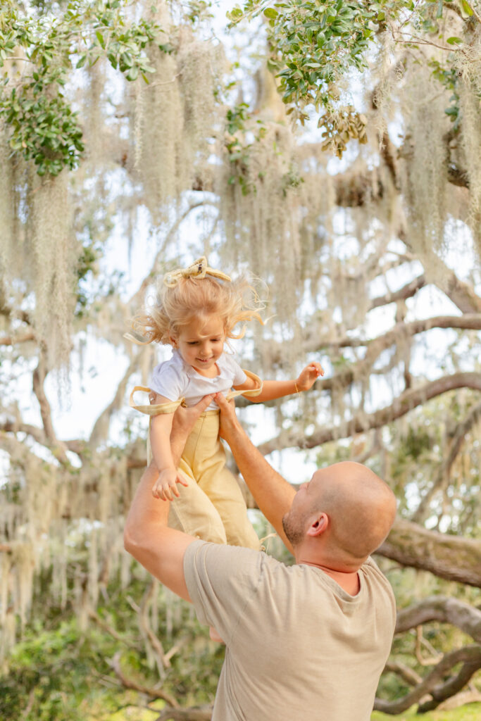 Dad playing with his little girl