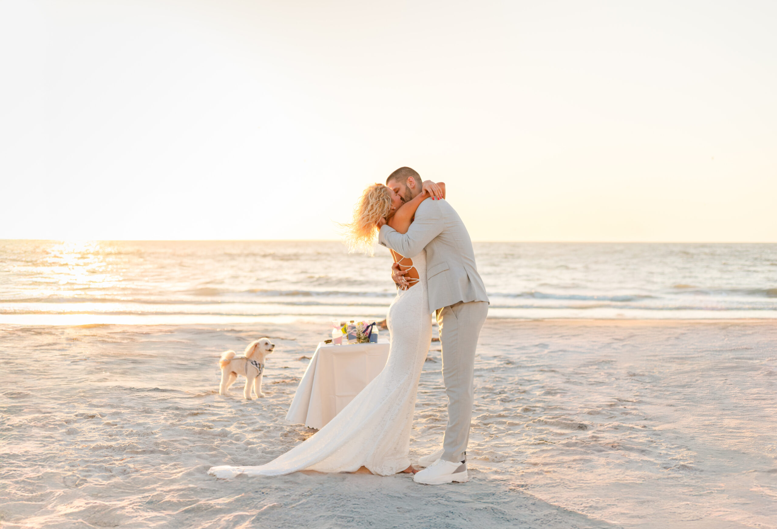 Wedding couple kissing at a beach